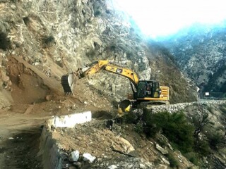 Heavy excavator working on the road to Chantry Flat