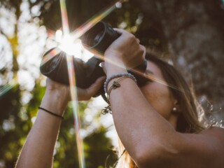 Woman looking through binoculars